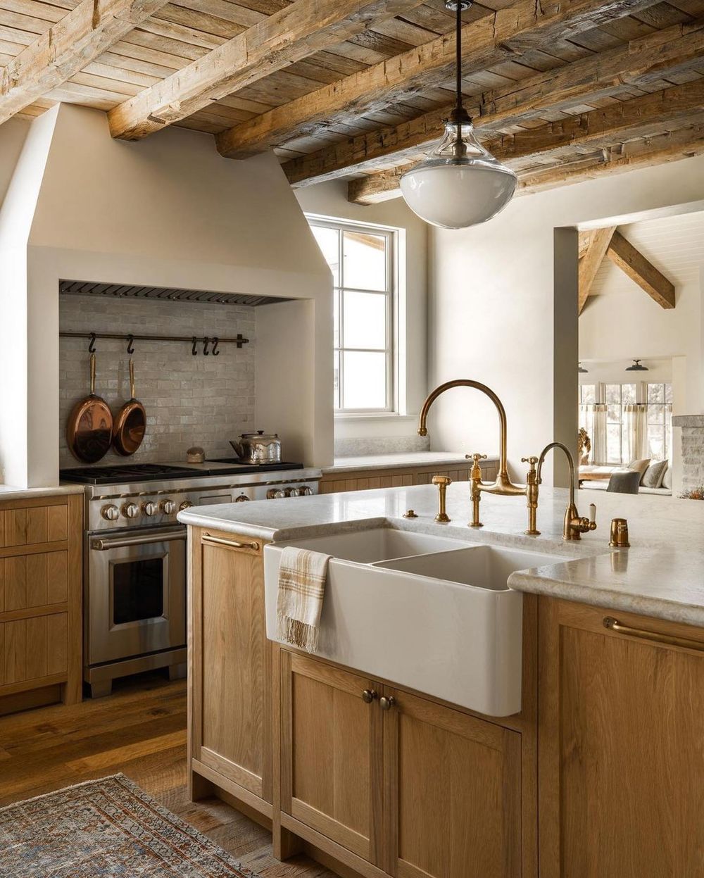 Rustic kitchen with farmhouse sink @amberinteriors