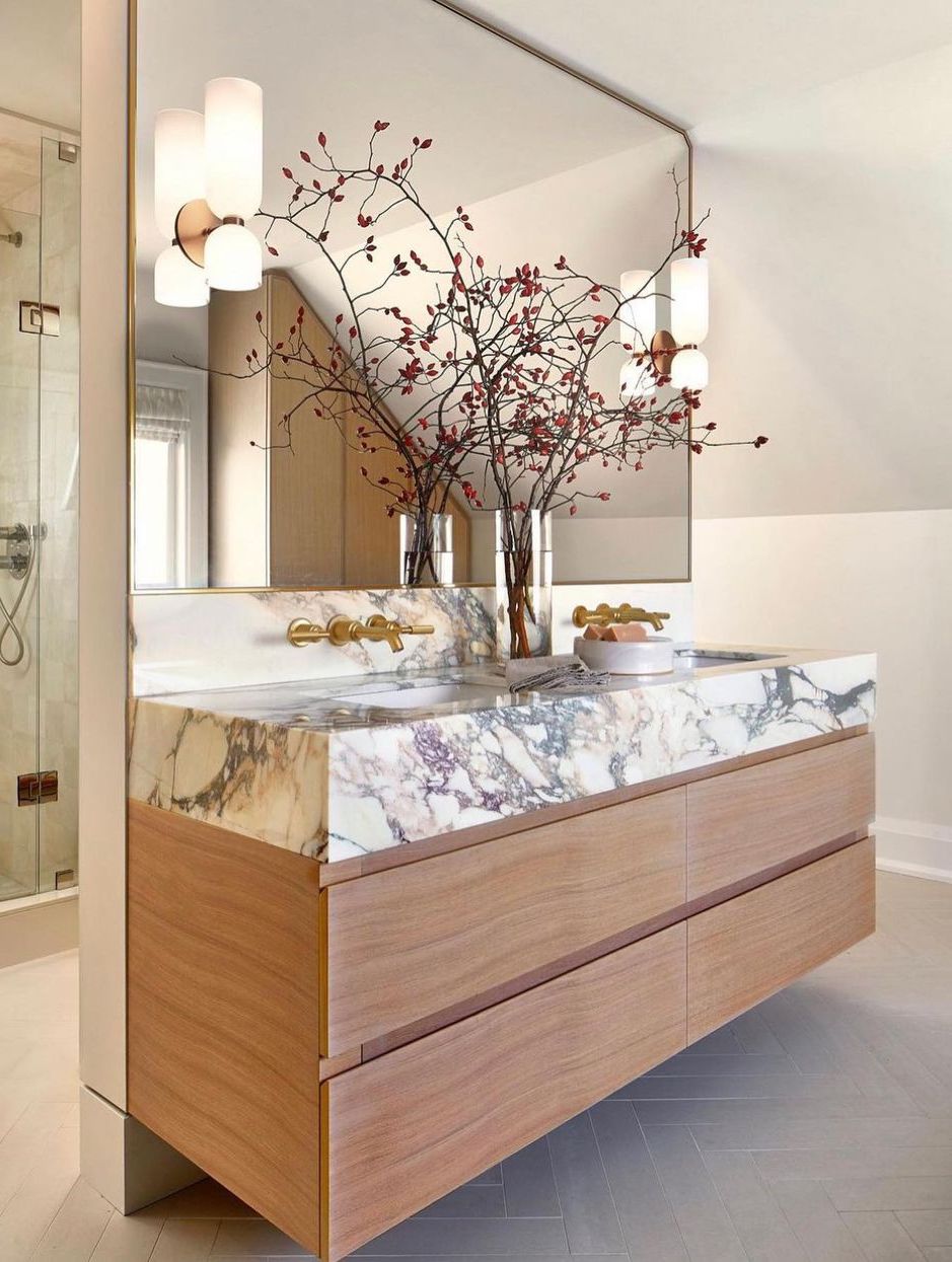 Marble bathroom countertops on wood vanity @emilygriffin_designer