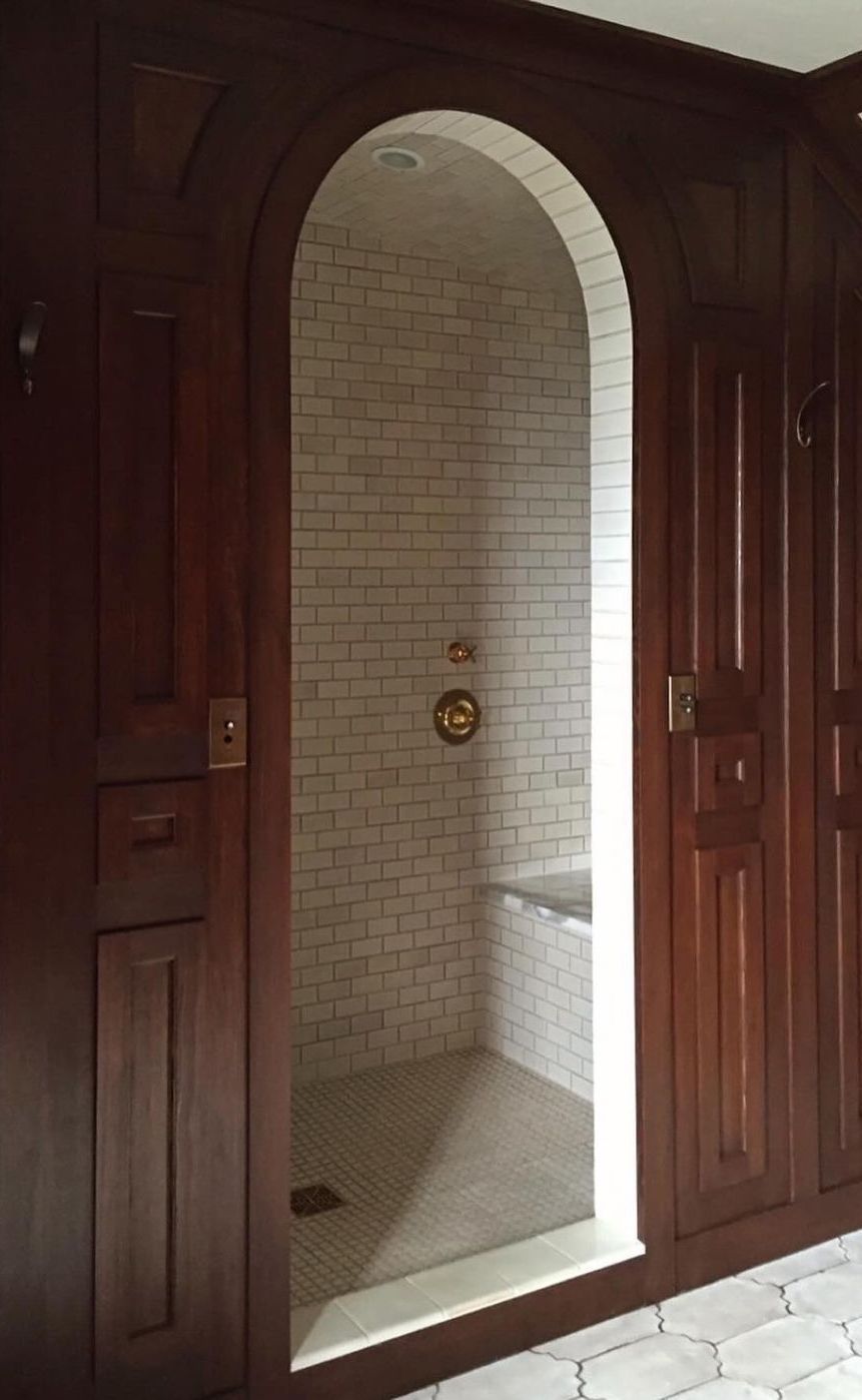 Shower ideas arched entry door wood paneling jhinteriordesign