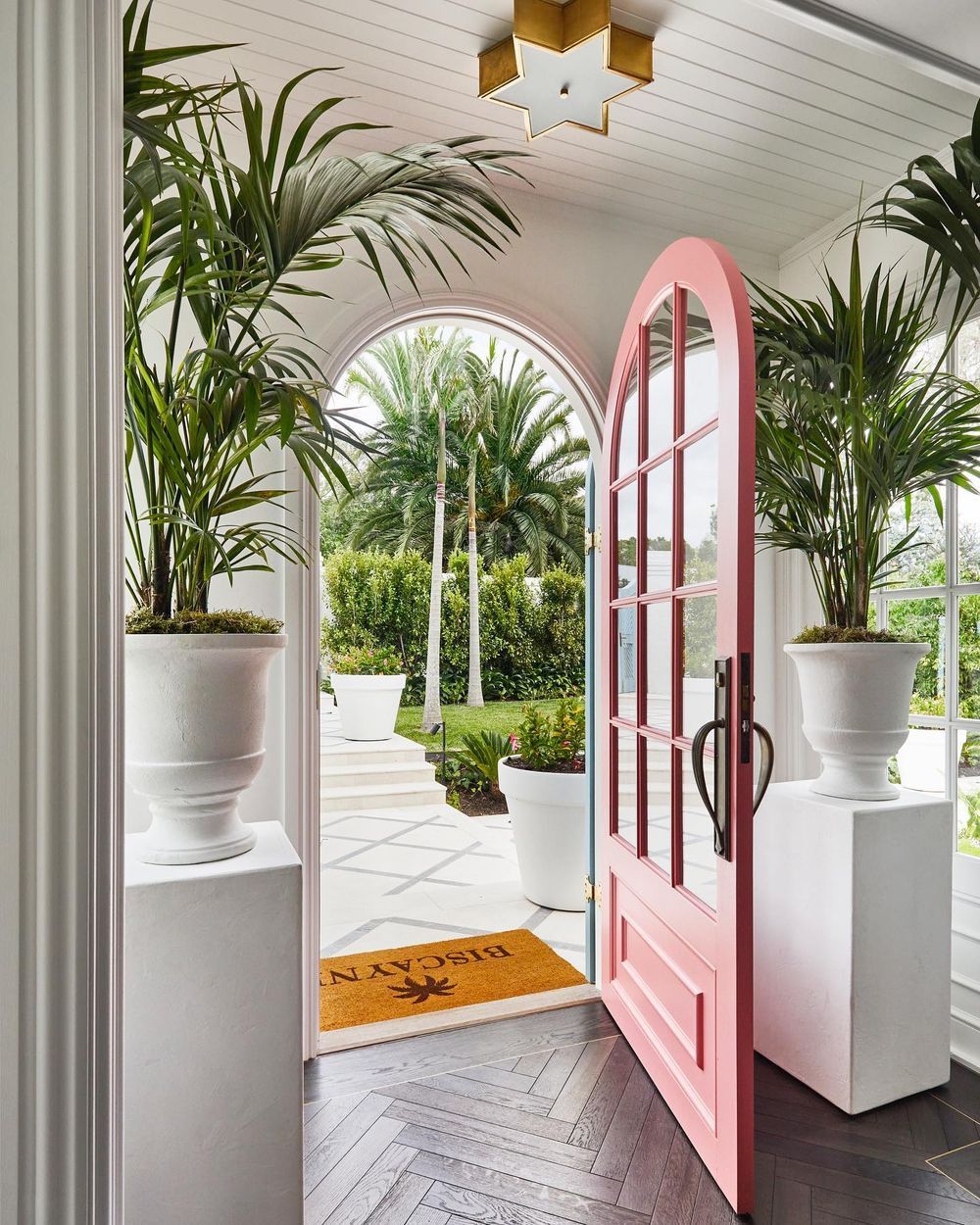 Beach home entryway tropical pink front door 