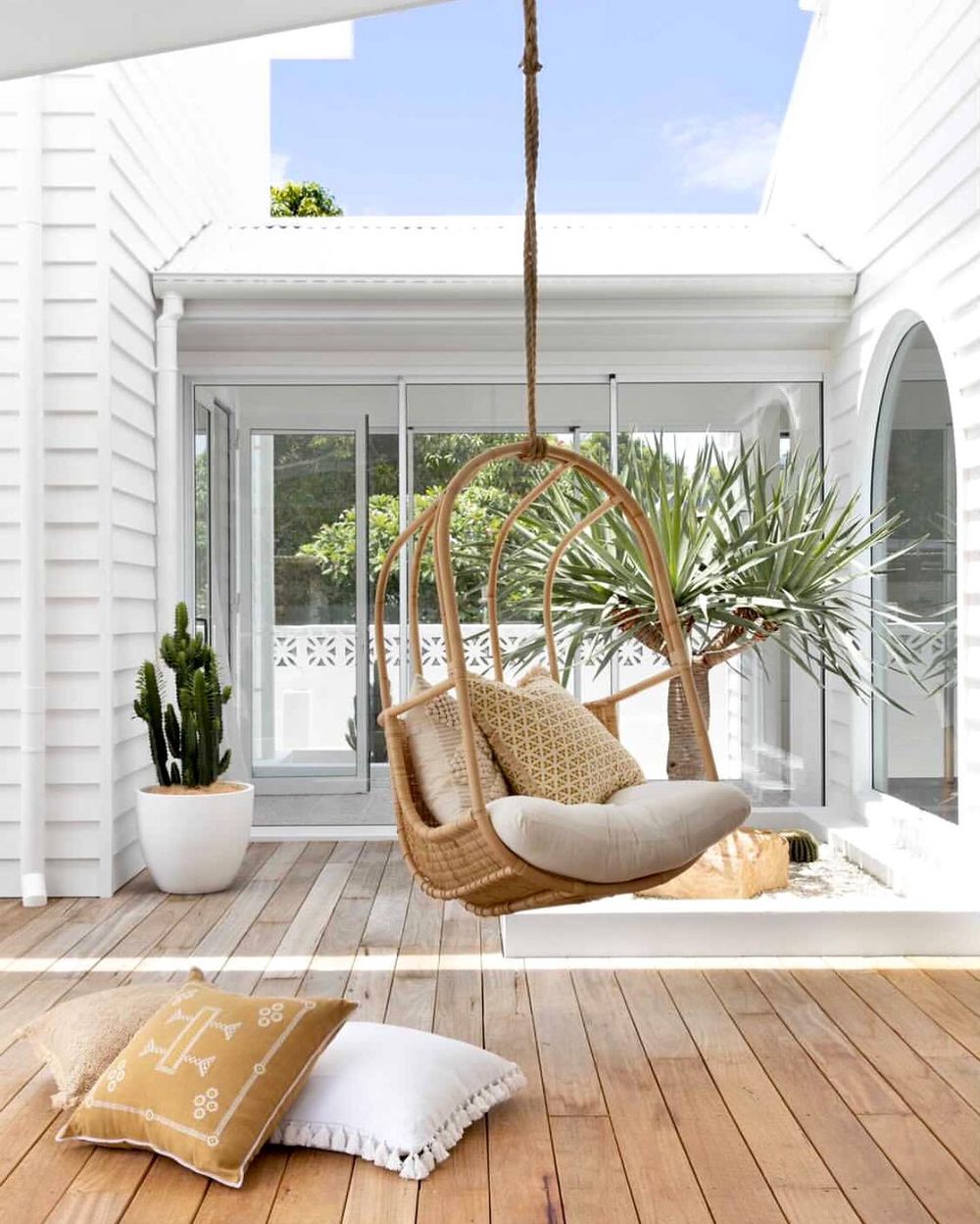 Coastal Patio with Rattan Hanging Chair ohana_beachhouse