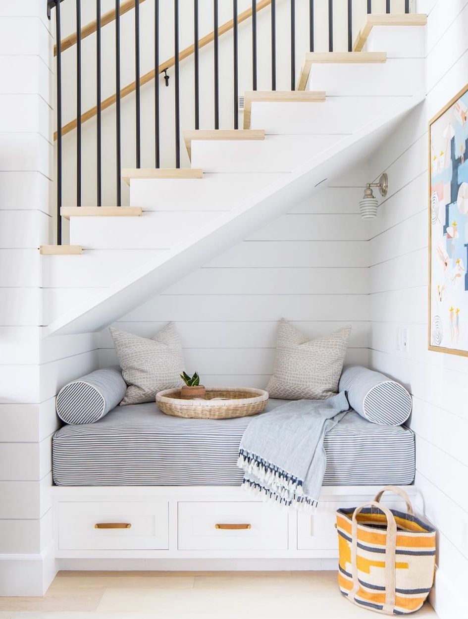 Farmhouse Staircase sitting nook under stairs shiplap walls