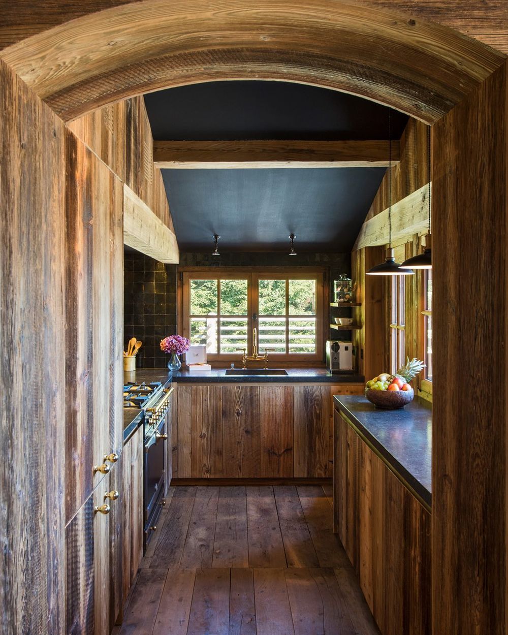 Ski Chalet Kitchen black countertops and rustic wood cabinets yves.garneau