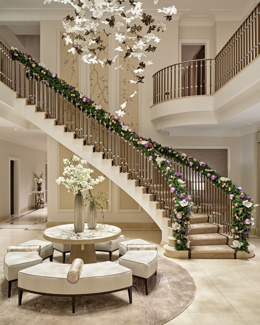 Elegant Christmas Decor Ideas Purple ornament garland on staircase @nicksmithphoto