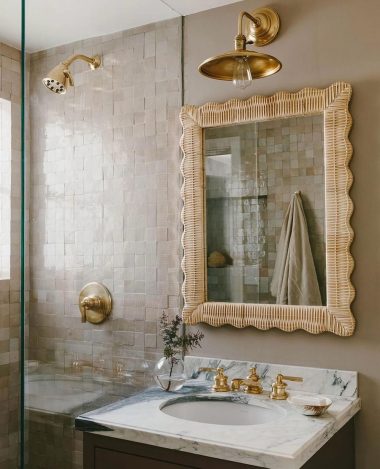 beige bathroom rattan mirror marble countertop sink jennifermillerstudio