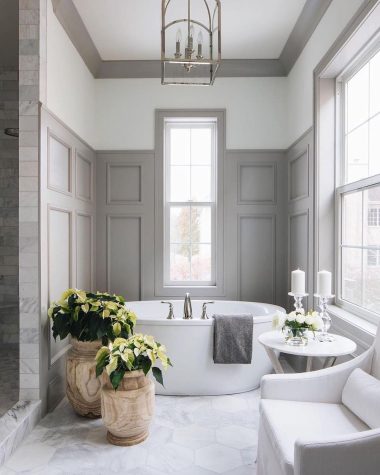 gray bathroom with white freestanding tub timbertrailshomes