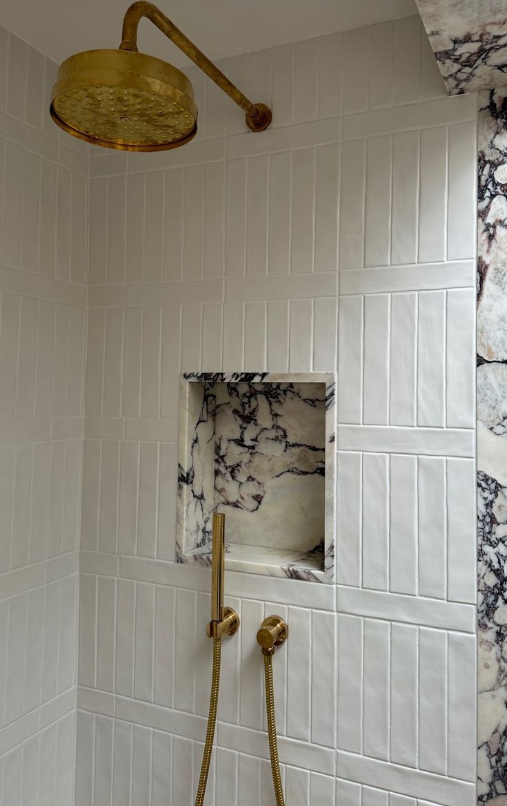 small marble shower niche in white tile shower millieturnerdesigns