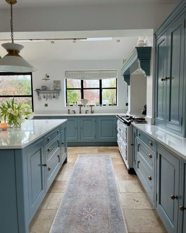 Blue kitchen with white countertops crack_the_shutters