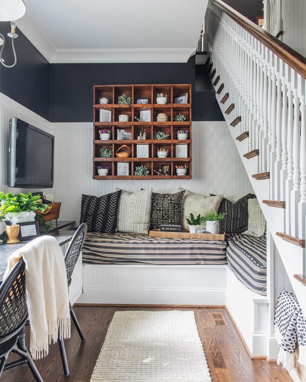 what are built ins under staircase banquette seat cozy nook @timbertrailshomes