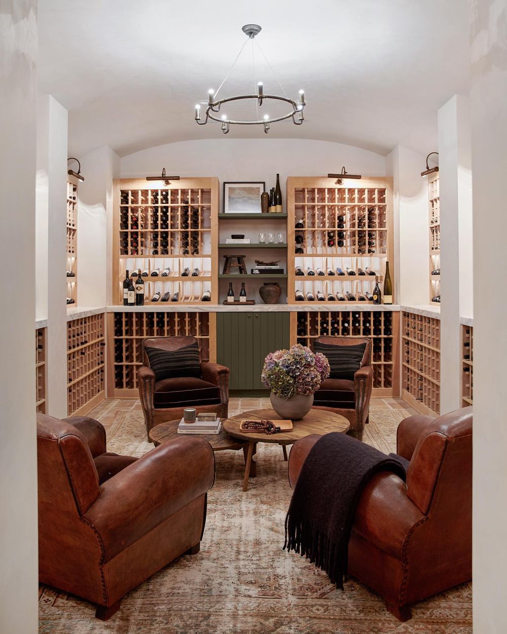 Wine cellar with leather seating amberinteriors