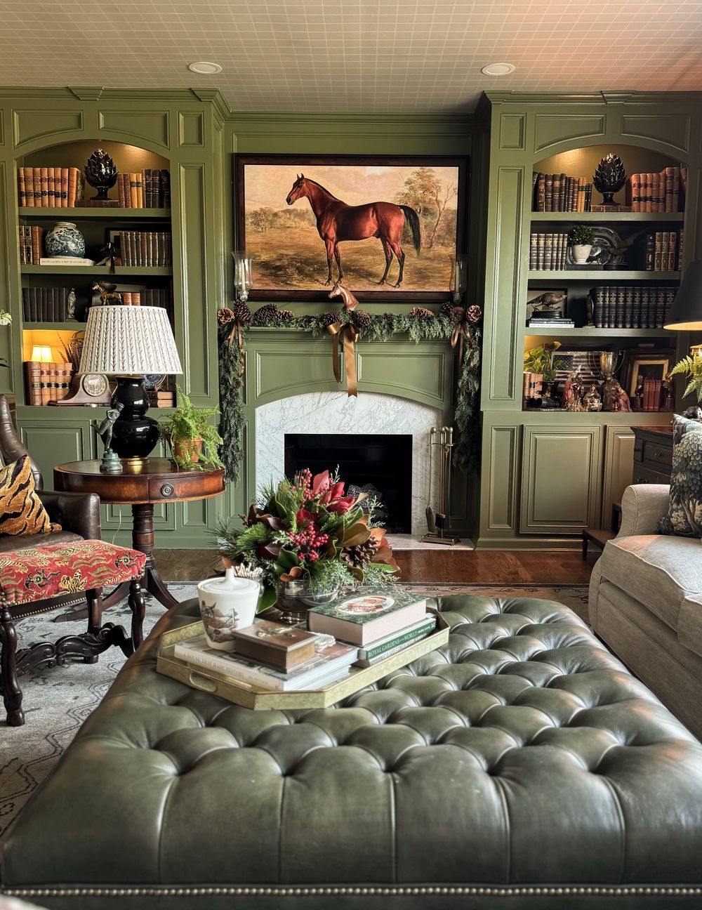 Equestrian living room forest green walls horse painting southerngentsandco