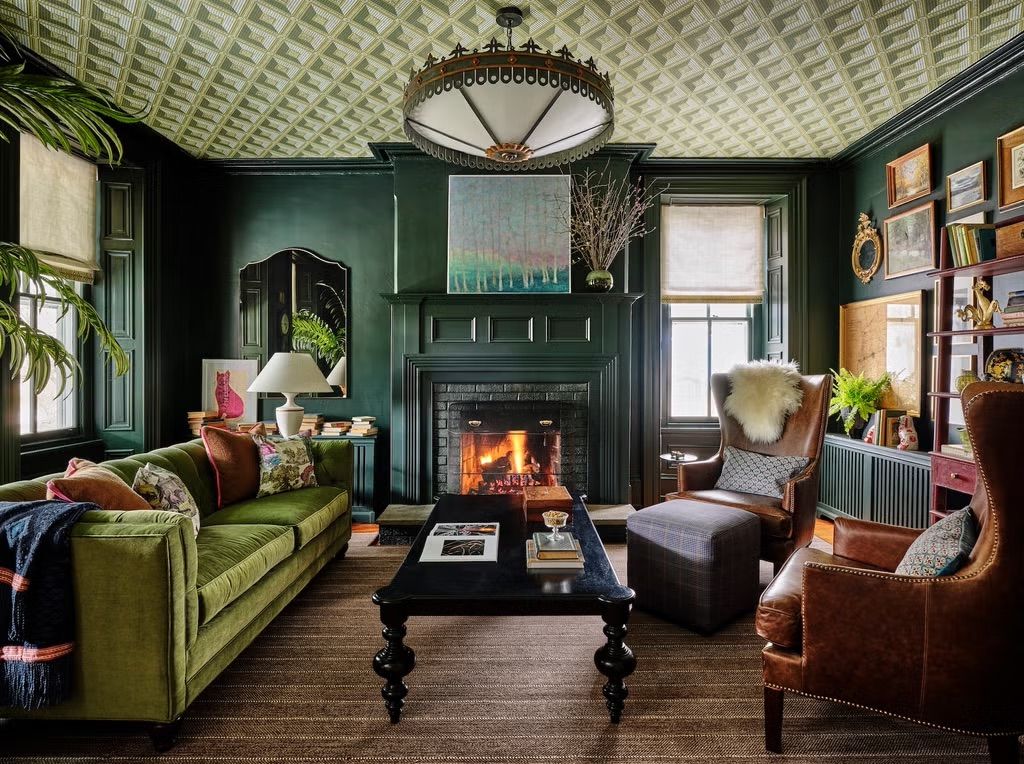 Green living room decorwith leather chairs and velvet sofa @camdengrace_interiordesign